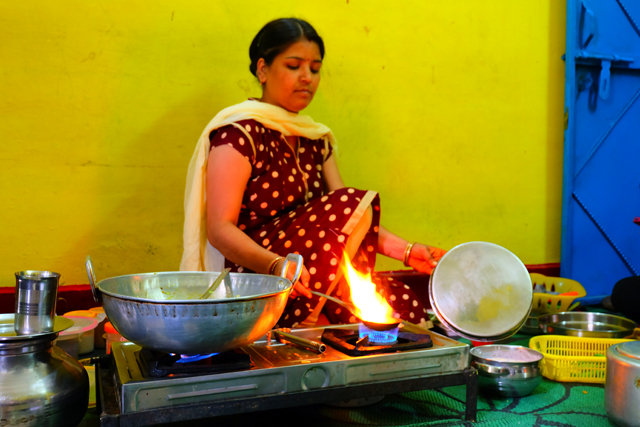 Rajni giving tourists a cooking lesson in her home in India