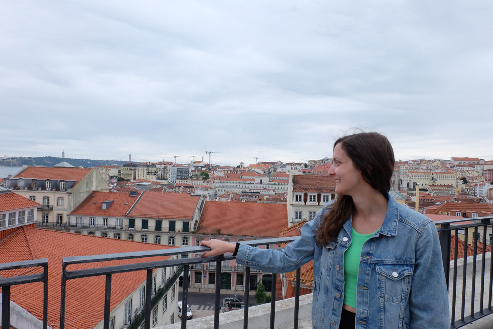 Girl looking out over the city of Lisbon, Portugal.