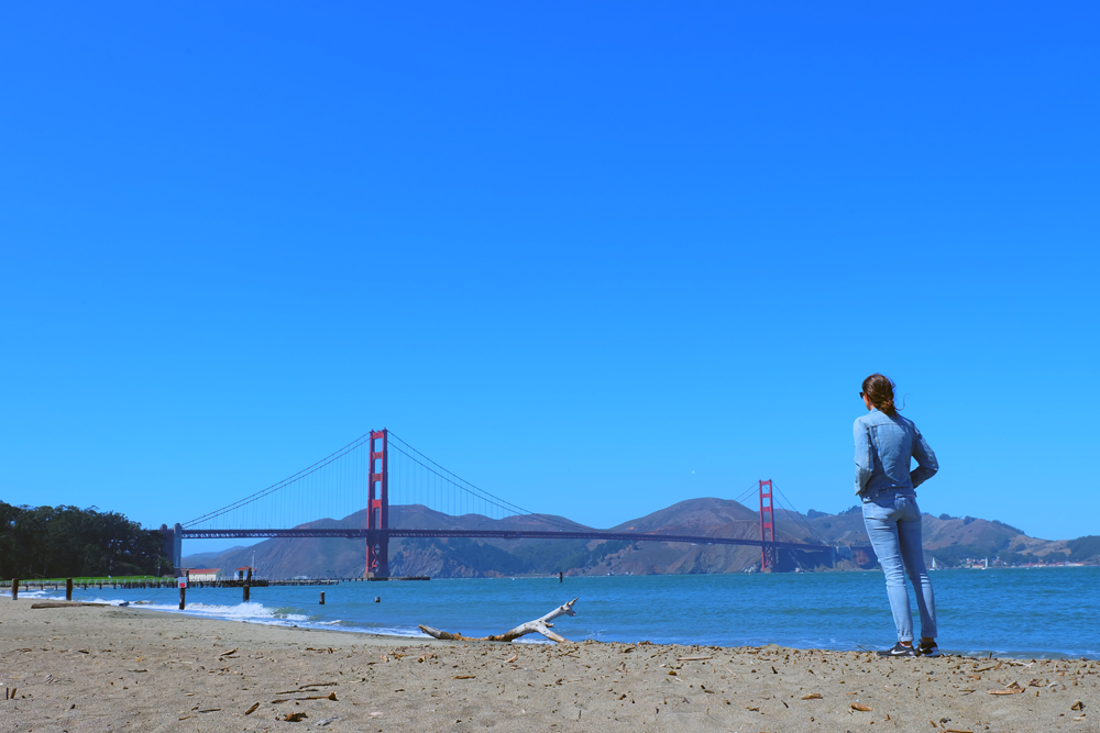 Girl staring out at the Golden Gate Bridge in San Francisco.