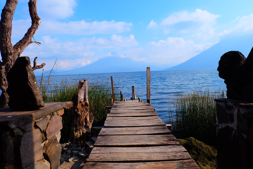 A wooden dock leading out to Lake Atitlan in Guatemala