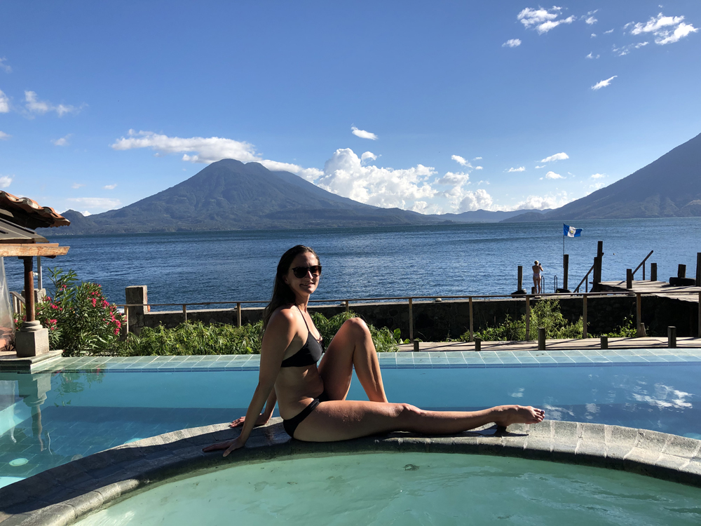 Lauren sitting at the side of a pool in Lake Atitlan.