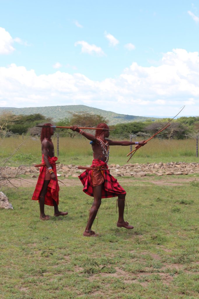 A warrior I met on my Maasai Mara safari shooting an arrow.