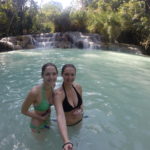 To girls in Kuang Si waterfalls in Laos