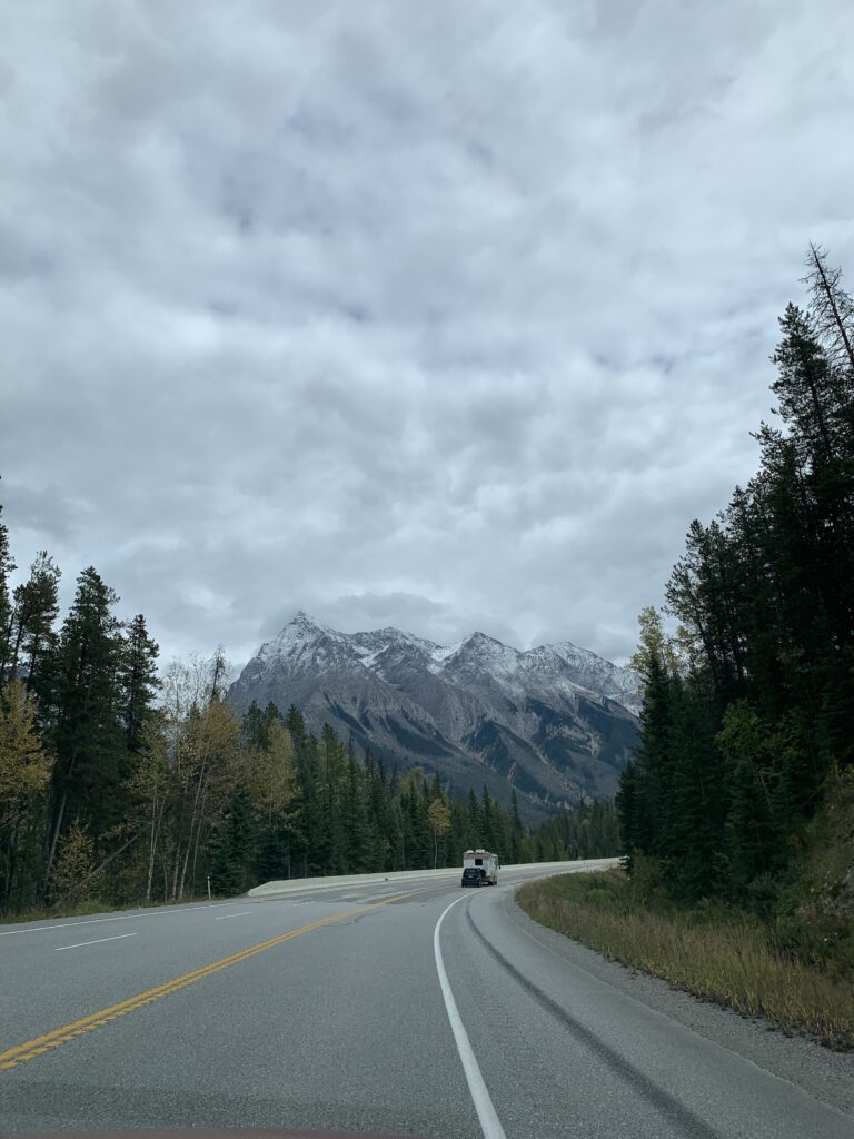 Mountains in the background of a road in Banff National Park